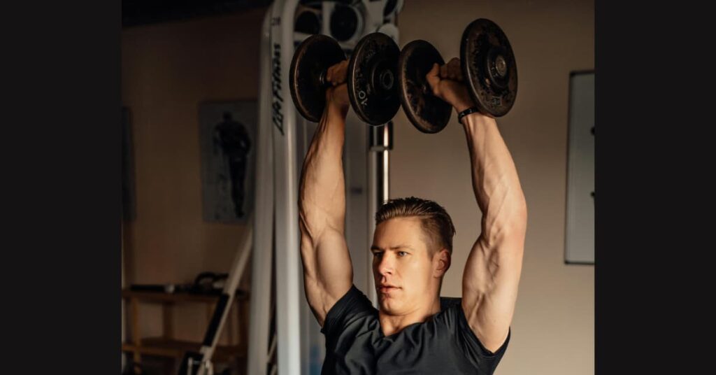 Dumbbell shoulder presses target muscles.
